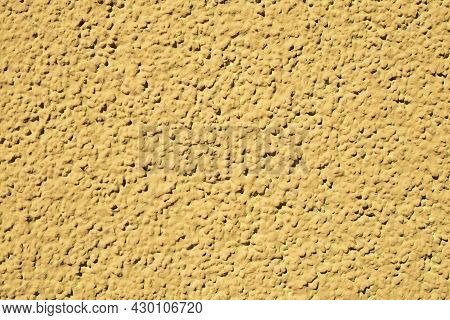 Rough Yellow Cementitious Surface. Texture Surface Wall Background