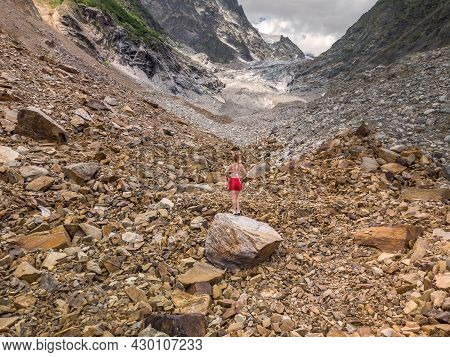 Tourist In Bikini Posing At The Chalaadi Glacier In Svaneti Region, Georgia, Caucasus.