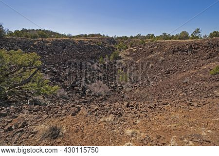 Looking Down Into A Volcanic Crater In El Malpais National Monument In New Mexico