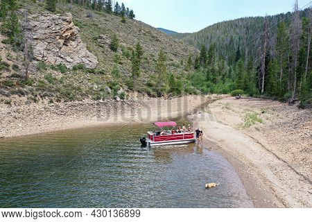 Aerial View Of Family And Friends Enjoying Afternoon Boating On Lake Granby In Arapaho National Recr