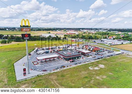 Mcdonalds Restaurant On The Highway With Trucks On Parking. Katy Wroclawskie, Poland - August 8, 202