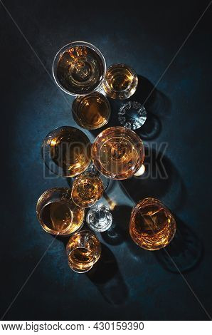 Strong Alcohol Drinks, Hard Liquors, Spirits And Distillates Iset In Glasses: Cognac, Scotch, Whiske