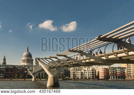 London/united Kingdom; 06/13/2014: View Of The Millennium Bridge At Sunset With St. Paul's Cathedral