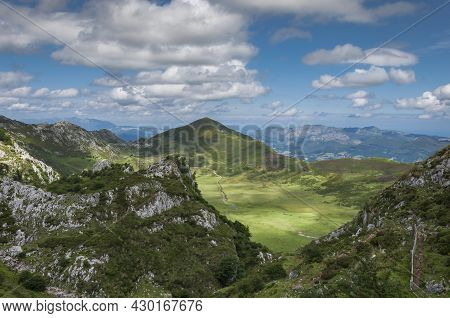 Landscape Of The Mountains Of The Picos De Europa In Cantabria With Blue Sky And White Clouds.