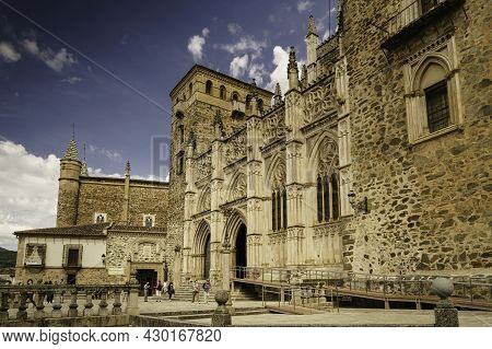 Guadalupe, Cáceres, Spain; 06,05,2021: Main Facade Of The Mudejar Gothic Monastery Of Guadalupe In S