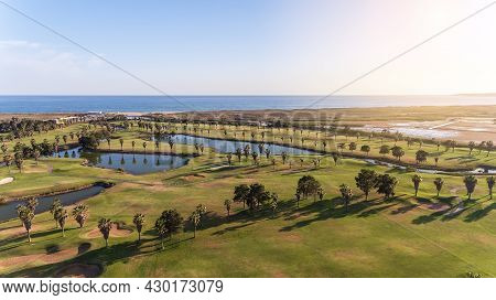 Green Golf Courses By The Sea. Salgados Beach. Portugal, Albufeira. Aerial View, Sunny Day In Algarv