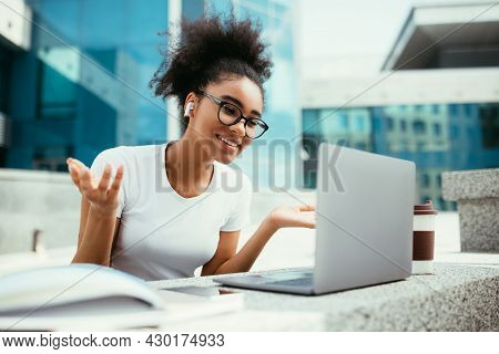 African Student Girl Video Calling Via Laptop Learning Online Outdoor