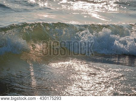 Colored Sea Waves With Splashes And White Breakers In Circeo Park, Sabaudia, Italy