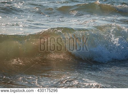Colored Sea Waves With Splashes And White Breakers In Circeo Park, Sabaudia, Italy