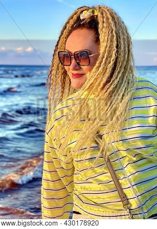 Pretty Woman With Curly Hair Against The Background Of The Baltic Sea At The Golden Hour Of Sunset I