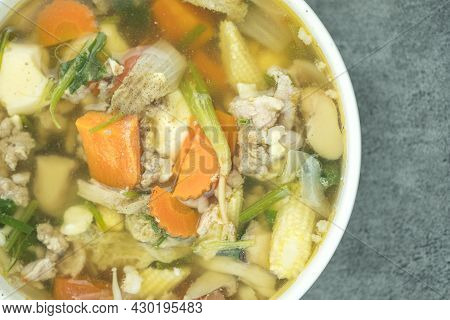 Clear Soup With Minced Pork And Mix Vegetables In White Bowl, Thai Homemade Food. Thai Called Gaeng-