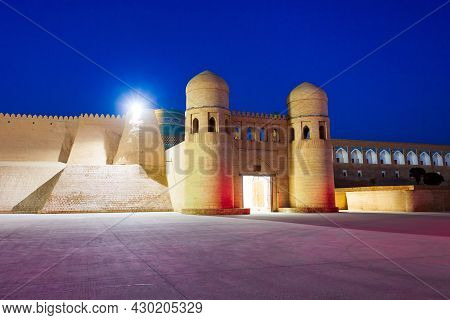 West Gate Of The Itchan Kala, An Ancient Walled Inner Town Of The City Of Khiva In Uzbekistan At Nig