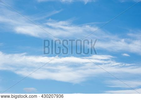Real Soft Textured Feathery Clouds In Blue Sky Background. On A Summer Day, Feathery Fluffy Clouds O