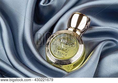 Varna, Bulgaria, August 14, 2021. Versace Eros Pour Femme Perfume Glass Bottle Against Soft Wavy Fol