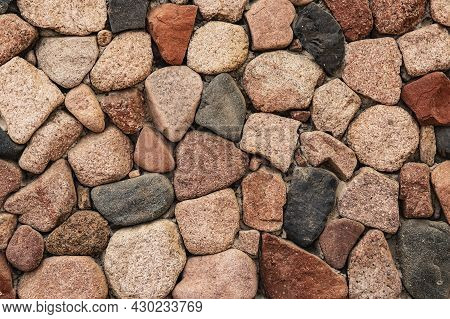 Beautiful Background From Natural Stones Of Different Colors. Decorative Masonry Of The Wall From La