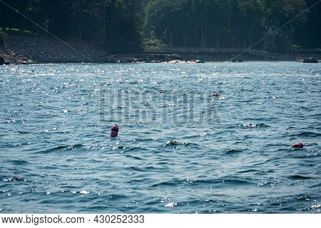 Lobster Trap Buoy Floating On A Choppy Ocean In The Atlantic Ocean