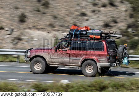 Novosibirsk, Russia - August 08, 2021:   
Red Toyota Land Cruiser Jeep  Driving Fast On Freeway In H