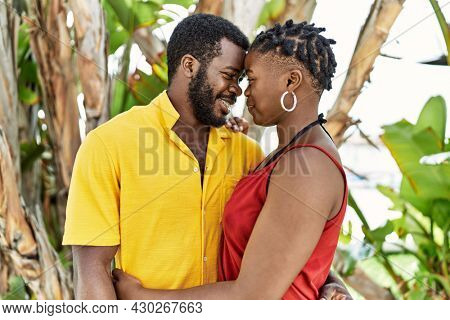 Young afircan american couple smiling happy and hugging at the city.