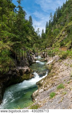 Waterfalls In The Weissbachschlucht In Chiemgau Bavaria With Mountains And Forest