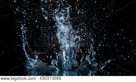 Freeze motion of water splash isolated on black background.