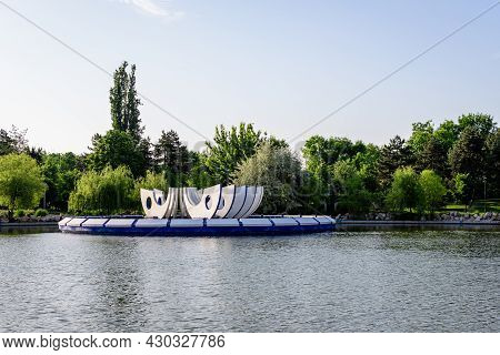 Landscape With The Lake, Decorative Fountain And Vivid Green Trees In Drumul Taberei Park (parcul Dr