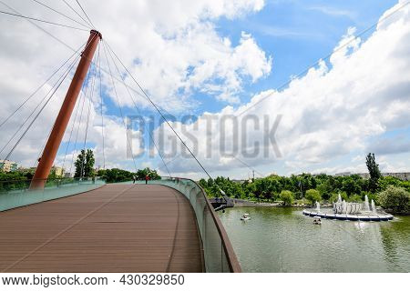 Landscape With The Modern Metallic, Wooden And Glass Bridge In Drumul Taberei Park (parcul Drumul Ta