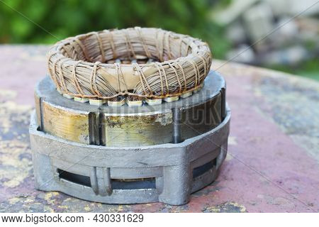 Disassembled Electric Motor Winding Coil. Electric Induction Motor. Coil Copper Repair. Industry Bac