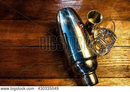 Bar Ustensils, Drink Concept. Cocktail Shaker Accessories On A Wooden Board.
