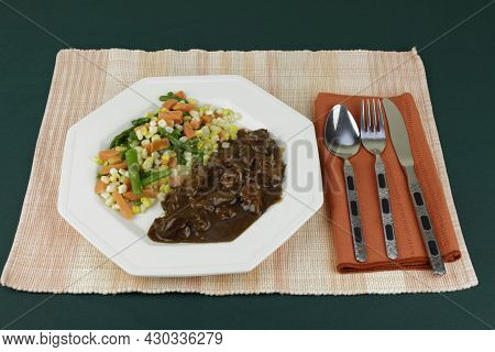 Mixed Steamed Vegetables Meal Of Green Asparagus, Orange Carrots And Yellow And White Corn With Beef