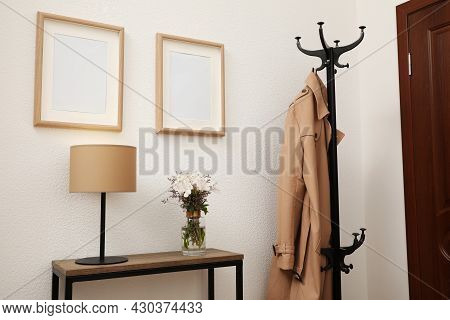 Bouquet With Alstroemeria Flowers On Console Table In Modern Hallway. Interior Design