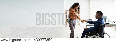 African American In Wheel Chair Shaking Hand
