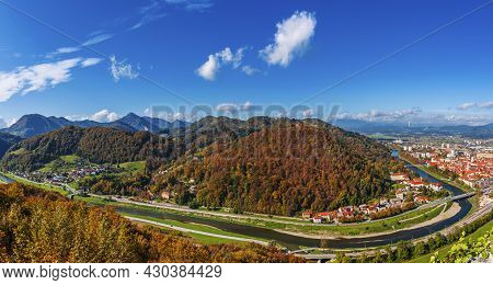 Aerial Panoramic Autumn View To The City Celje In Slovenia. Autumn Trees, Green Meadows And Red Roof