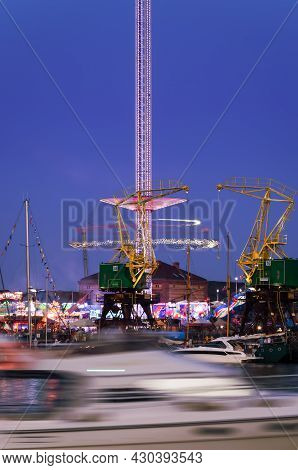 Szczecin, West Pomeranian - Poland - 2021: Amusement Park And Old Historic Harbor Cranes In The Area