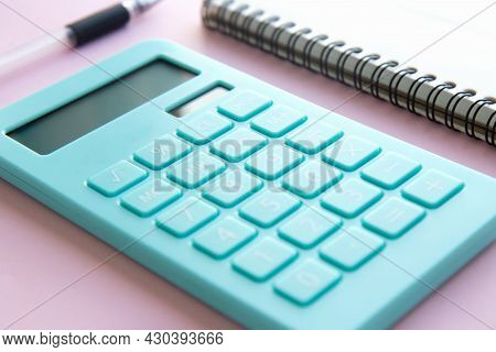 Mint Calculator, Notebook And Pen On Pink Background