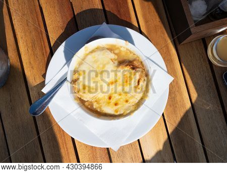 French Caramelized Onion Soup With Croutons And Gruyere Cheesse From Oven