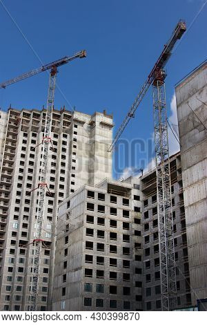 Crane Near Construction Concrete Modern Building Skyscraper.