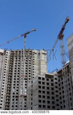 Crane Near Construction Concrete Modern Building Skyscraper.