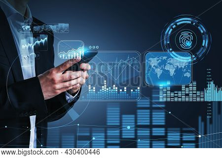 Businessman Hand Holds Smartphone, Blue Hologram Glowing Digital Information Security Interface. Con