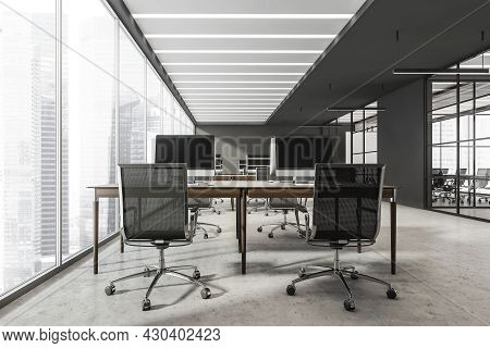 Panoramic Interior With Combined Office Desks And Black Rolling Chairs. Grey Walls, Two Led Linear L