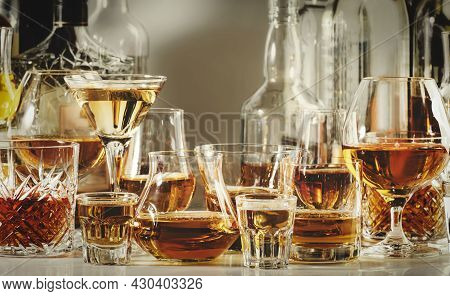 Strong Alcohol Drinks, Hard Liquors, Spirits And Distillates Iset In Glasses And Bottles: Cognac, Sc