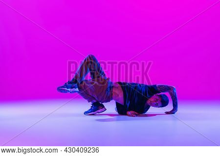 Modern Dance Style. Hip Hop, Break Dancing Dancer In Action, Motion In Dark Clothes Isolated Over Br