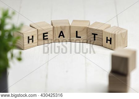 Six Wooden Cubes, Blocks Standing On Table And Showing Word Health. Conceptual Image About Human Rig