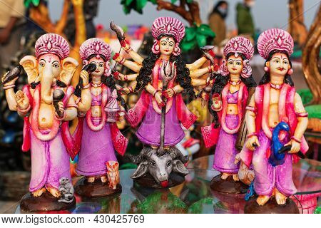 Beautiful Handmade Statuette Of A Goddess Durga Idol Is Displayed In A Shop For Sale In Blurred Back