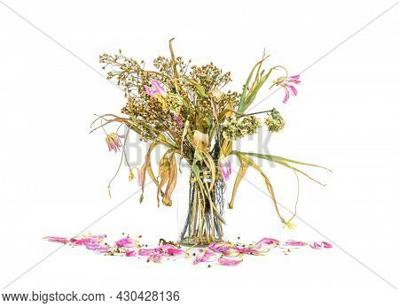 wilted flowers bouquet in a clear glass vase ,Vintage filtered