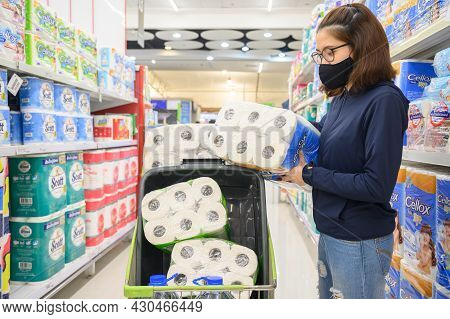 Chiang Rai, Thailand : 10/april/2020 : Asian Woman Wearing Mask While Shopping Tissue Paper Rolls In
