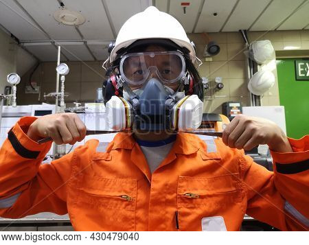 Multi-purpose Respirator Half Mask For Toxic Gas Protection. The Man Prepare To Wear Multi-purpose H