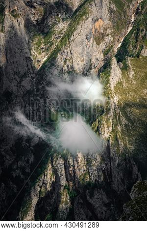 Clouds On The Mountains In Picos De Europa National Park, Spain