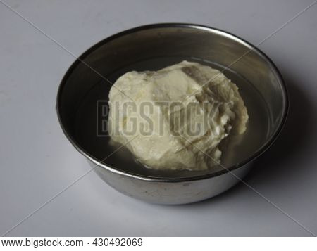 Butter Ball From Milk At Home - Home Made Butter In A Cup And Holding In A Hand Isolated On White Ba