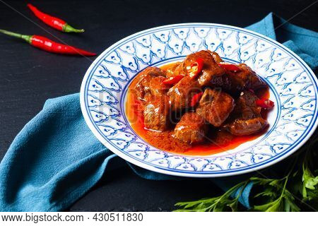 Asian Food Concept Sambal Goreng Daging Beef In Red Curry Chili And Spice Paste On Black Background