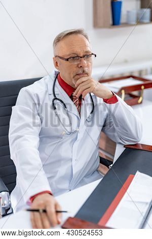 Stylish Handsome Doctor Working With Computer. Professional Medical Worker Writing Online Receipt.